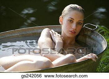Stock Photo - woman in wash 
tub. fotosearch 
- search stock 
photos, pictures, 
images, and photo 
clipart