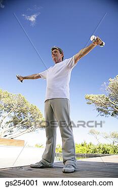 Stock Photography - man lifting free 
weights. fotosearch 
- search stock 
photos, pictures, 
images, and photo 
clipart