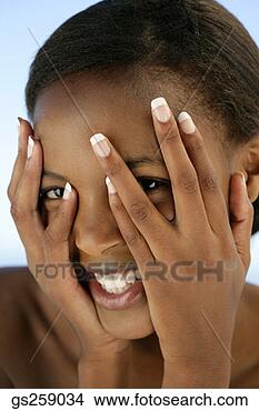 Stock Photo - woman covering 
face. fotosearch 
- search stock 
photos, pictures, 
images, and photo 
clipart