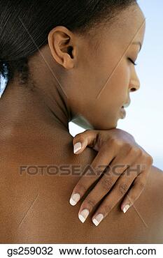 Stock Photo - woman rubbing 
shoulder. fotosearch 
- search stock 
photos, pictures, 
images, and photo 
clipart