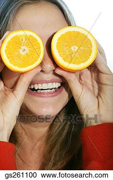 Stock Photography - woman holding 
oranges over eyes. 
fotosearch - search 
stock photos, 
pictures, images, 
and photo clipart