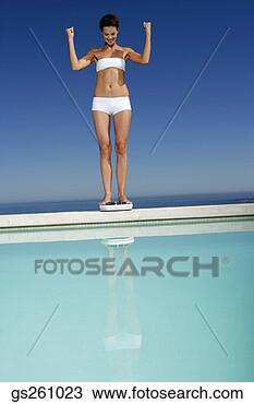 Stock Photo - woman on scale. 
fotosearch - search 
stock photos, 
pictures, images, 
and photo clipart