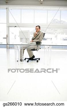 Stock Photography - businessman on 
computer in spacious 
office. fotosearch 
- search stock 
photos, pictures, 
images, and photo 
clipart