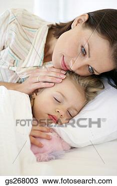 Stock Photo - mother comforting 
sleeping daughter. 
fotosearch - search 
stock photos, 
pictures, images, 
and photo clipart