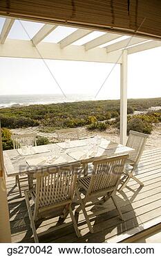 Stock Photo - outdoor dining 
table with place 
settings. fotosearch 
- search stock 
photos, pictures, 
images, and photo 
clipart