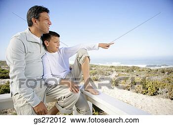 Stock Photo - man with boy on 
railing. fotosearch 
- search stock 
photos, pictures, 
images, and photo 
clipart