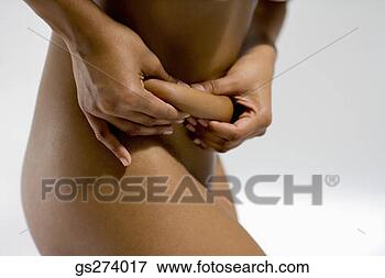 Picture - nude woman squeezing 
fat on stomach. 
fotosearch - search 
stock photos, 
pictures, images, 
and photo clipart