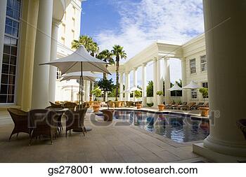 Stock Photography - hotel patio and 
pool. fotosearch 
- search stock 
photos, pictures, 
images, and photo 
clipart