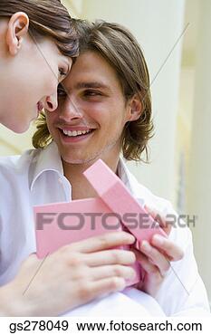 Stock Photograph - man and woman 
opening gift box. 
fotosearch - search 
stock photos, 
pictures, images, 
and photo clipart