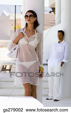 Stock Photo - woman in bathing 
suit, and man. 
fotosearch - search 
stock photos, 
pictures, images, 
and photo clipart