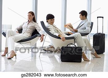Stock Photo - businesspeople 
waiting lounging 
in lobby. fotosearch 
- search stock 
photos, pictures, 
images, and photo 
clipart