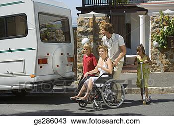 Stock Photo - woman in wheelchair 
on family trip. 
fotosearch - search 
stock photos, 
pictures, images, 
and photo clipart