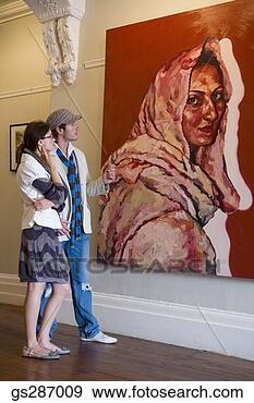 Stock Photograph - couple looking 
at painting in 
art museum. fotosearch 
- search stock 
photos, pictures, 
images, and photo 
clipart