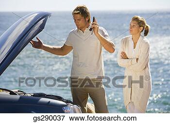 Picture - couple with car 
trouble. fotosearch 
- search stock 
photos, pictures, 
images, and photo 
clipart
