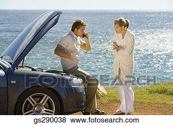 Stock Photo - couple with car 
trouble. fotosearch 
- search stock 
photos, pictures, 
images, and photo 
clipart
