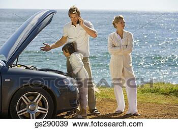 Stock Photograph - couple with car 
trouble. fotosearch 
- search stock 
photos, pictures, 
images, and photo 
clipart