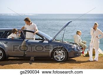 Stock Photo - family with car 
trouble. fotosearch 
- search stock 
photos, pictures, 
images, and photo 
clipart