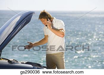 Stock Photo - man on cell phone 
with car trouble. 
fotosearch - search 
stock photos, 
pictures, images, 
and photo clipart