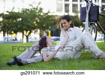 Stock Photography - affectionate businesspeople 
relaxing outdoors. 
fotosearch - search 
stock photos, 
pictures, images, 
and photo clipart
