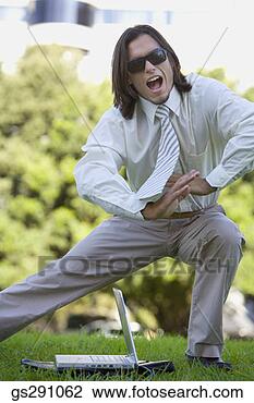Stock Photo - businessman with 
laptop computer 
stretching outdoors. 
fotosearch - search 
stock photos, 
pictures, images, 
and photo clipart