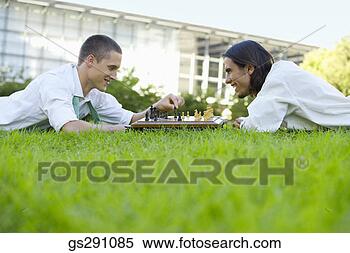 Stock Image - businessmen playing 
chess outdoors. 
fotosearch - search 
stock photos, 
pictures, images, 
and photo clipart