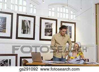 Stock Photo - businesspeople 
working. fotosearch 
- search stock 
photos, pictures, 
images, and photo 
clipart