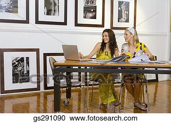 Stock Photography - businesswomen 
using laptop computer. 
fotosearch - search 
stock photos, 
pictures, images, 
and photo clipart