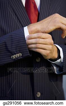 Stock Photo - hands adjusting 
cuff of suit. 
fotosearch - search 
stock photos, 
pictures, images, 
and photo clipart