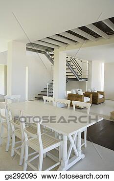 Stock Image - dining room table 
by staircase. 
fotosearch - search 
stock photos, 
pictures, images, 
and photo clipart