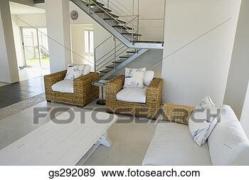 Stock Photograph - staircase by modern 
living room. fotosearch 
- search stock 
photos, pictures, 
images, and photo 
clipart