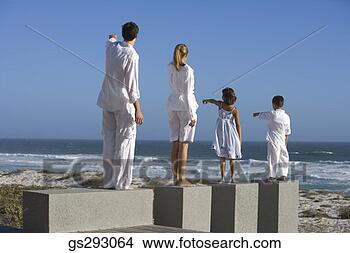 Stock Photo - back view of family 
pointing on seashore. 
fotosearch - search 
stock photos, 
pictures, images, 
and photo clipart