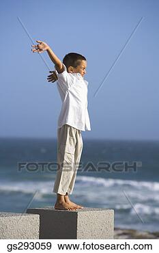 Stock Photograph - boy with open 
arms on seashore. 
fotosearch - search 
stock photos, 
pictures, images, 
and photo clipart