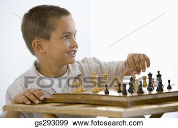Stock Photograph - boy playing chess. 
fotosearch - search 
stock photos, 
pictures, images, 
and photo clipart