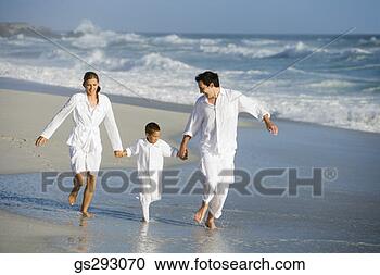 Stock Photography - family walking 
on beach. fotosearch 
- search stock 
photos, pictures, 
images, and photo 
clipart