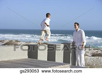 Stock Photo - father and son 
playing on pier. 
fotosearch - search 
stock photos, 
pictures, images, 
and photo clipart