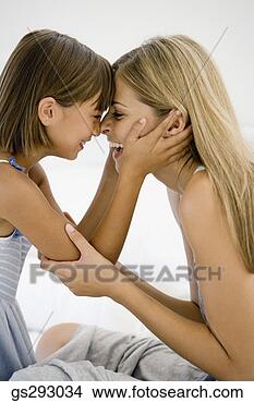 Stock Photo - mother and daughter 
face to face. 
fotosearch - search 
stock photos, 
pictures, images, 
and photo clipart