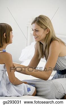 Stock Photography - mother and daughter 
smiling. fotosearch 
- search stock 
photos, pictures, 
images, and photo 
clipart
