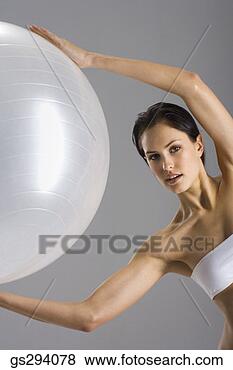 Stock Photo - woman exercising 
with exercise 
ball. fotosearch 
- search stock 
photos, pictures, 
images, and photo 
clipart