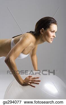 Picture - woman doing push 
ups on exercise 
ball. fotosearch 
- search stock 
photos, pictures, 
images, and photo 
clipart