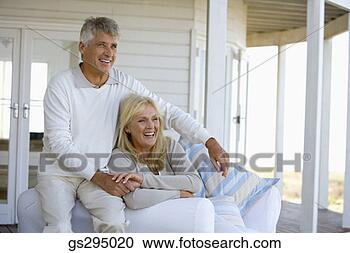 Stock Photography - couple on couch. 
fotosearch - search 
stock photos, 
pictures, images, 
and photo clipart