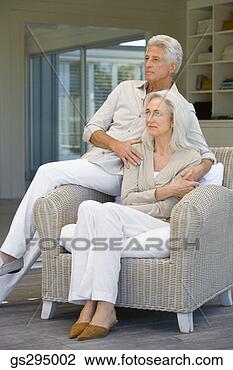 Stock Photo - couple sitting 
on chair. fotosearch 
- search stock 
photos, pictures, 
images, and photo 
clipart