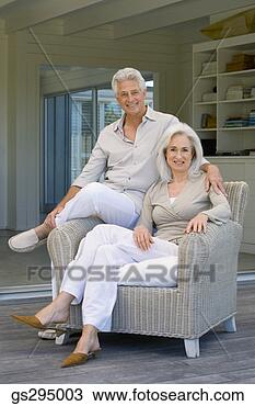 Stock Photo - couple sitting 
on chair. fotosearch 
- search stock 
photos, pictures, 
images, and photo 
clipart