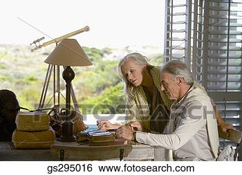 Stock Photo - couple at table 
indoors. fotosearch 
- search stock 
photos, pictures, 
images, and photo 
clipart