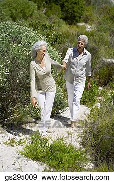 Stock Photograph - couple walking 
outdoors. fotosearch 
- search stock 
photos, pictures, 
images, and photo 
clipart