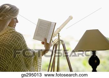 Stock Photo - woman reading 
book. fotosearch 
- search stock 
photos, pictures, 
images, and photo 
clipart