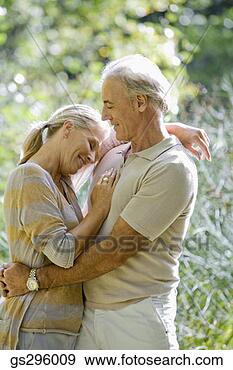 Stock Photograph - affectionate couple 
in field. fotosearch 
- search stock 
photos, pictures, 
images, and photo 
clipart