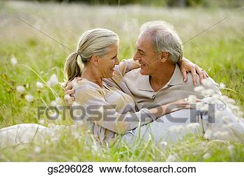 Stock Photo - affectionate couple 
in field. fotosearch 
- search stock 
photos, pictures, 
images, and photo 
clipart