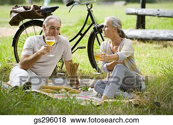 Stock Photo - couple having 
picnic. fotosearch 
- search stock 
photos, pictures, 
images, and photo 
clipart