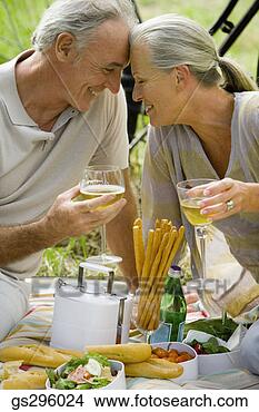 Stock Photo - couple having 
picnic. fotosearch 
- search stock 
photos, pictures, 
images, and photo 
clipart