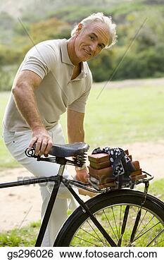 Stock Photo - man with bike. 
fotosearch - search 
stock photos, 
pictures, images, 
and photo clipart
